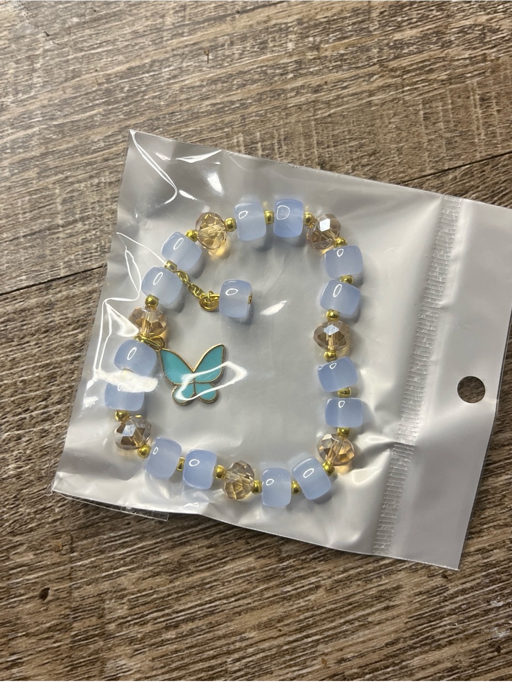 Light Blue Beaded Bracelet with Turquoise Butterfly Charm